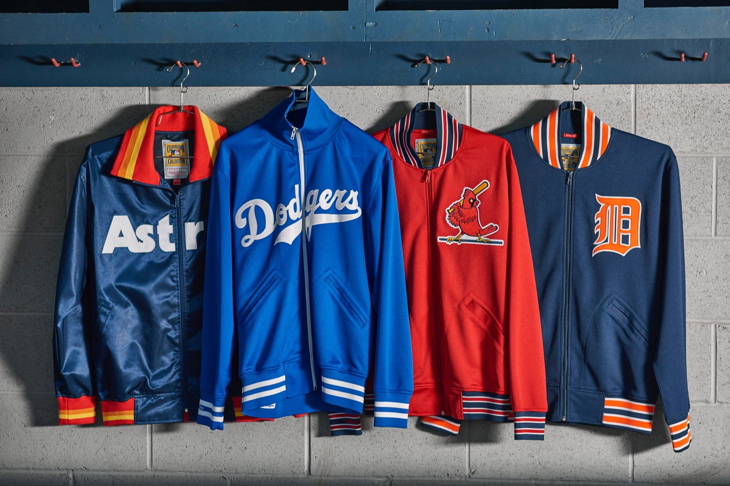 Mitchell & Ness MLB Cooperstown track jackets, Astros, Dodgers, Cardinals, and Tigers, on hangers